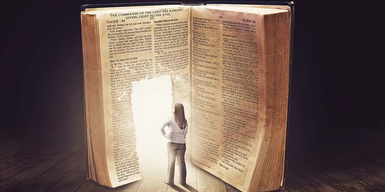 An open Bible resting in warm light